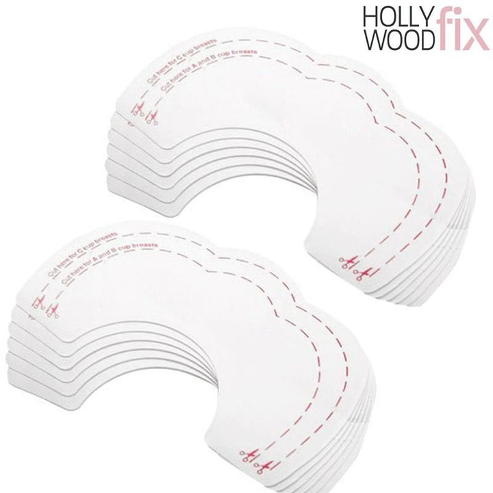 A stack of Fashiongirl Breast Tape Hollywood Fix Instant Lift - 10 pcs, arranged in two piles, shows crescent-shaped strips with dashed lines and scissors icons indicating where to cut.