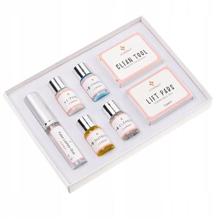 The Lash Lift Kit by IconSign from Fashiongirl offers an at-home salon-quality eyelash perm, with small bottles, a spray bottle, and Clean Tool and Lift Pads boxes neatly arranged in a white tray for easy use.