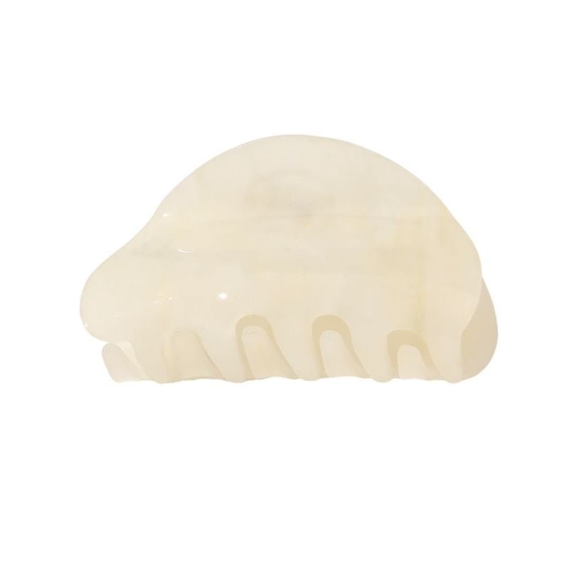 The SOHO Cleo Hair Claw - White by SOHO is a translucent, off-white, medium-sized clip with a curved, semi-circular design and five wide teeth, shown on a plain white background.
