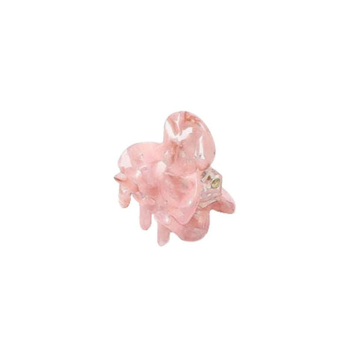 The SOHO Hara Mini Hair Claw in Blush is a small, glossy light pink plastic clip with rounded edges and interlocking teeth for a secure hold.