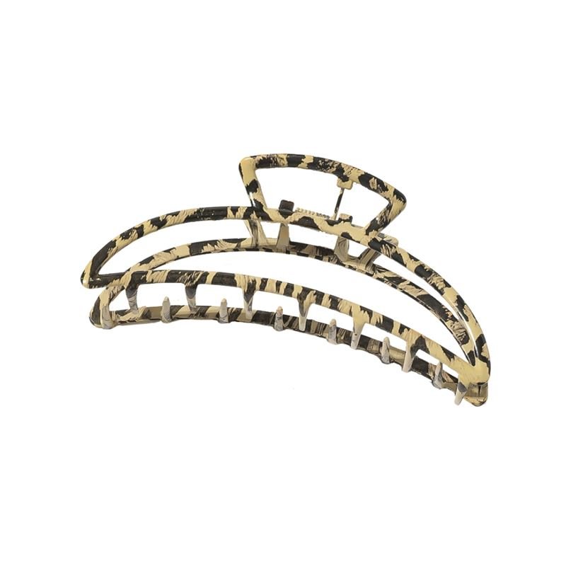 The SOHO Leopard Metal Barette Hair Claw, with its open framework and bold gold and black leopard pattern, is a chic accessory that adds striking style to any look.