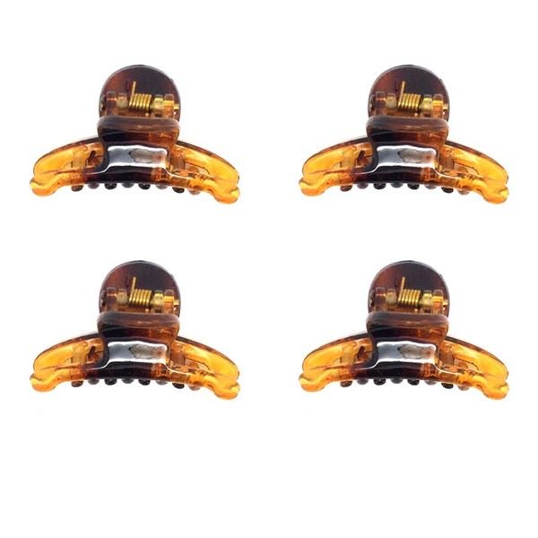 Four SOHO Mini Tortoise Hair Claws by SOHO, each with a metal spring, are arranged in a 2x2 grid on a white background—ideal for creating a natural look.