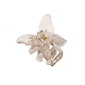 Die SOHO Naja Hair Claw – Espresso von SOHO ist ein transparentes braunes Haaraccessoire mit einer metallischen Feder, das Stil und Funktionalität für jeden Anlass vereint.