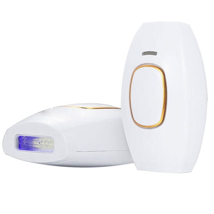 Two white UNIQ IPL Hair Removal Devices with gold accents are shown—one upright, one on its side. Each offers smooth, pain-free permanent hair reduction at home with 600,000 flashes for convenient long-term results.